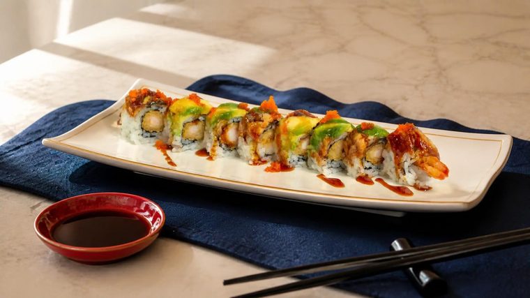 Sterling Roll topped with toasted eel, avocado and capelin roe